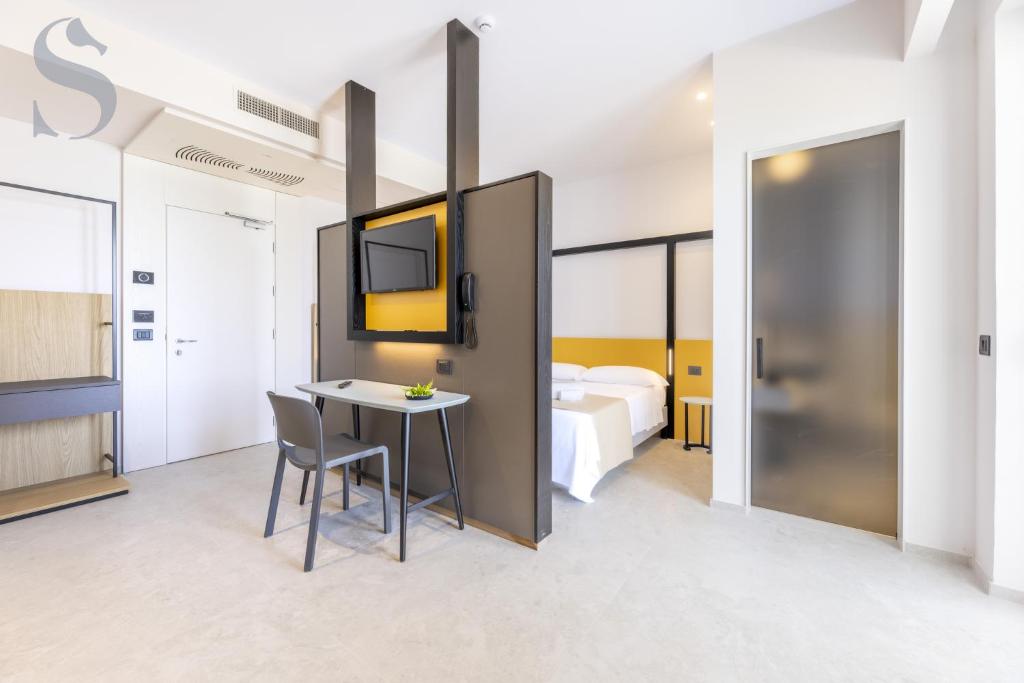 Postel nebo postele na pokoji v ubytování Sud Hotel Pulsano