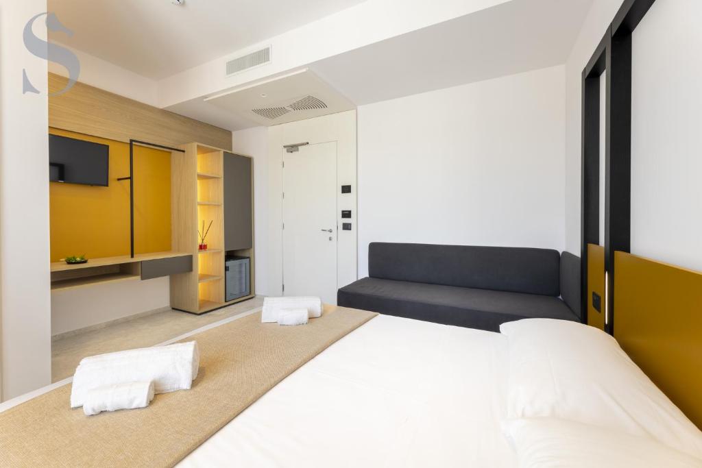 Postel nebo postele na pokoji v ubytování Sud Hotel Pulsano