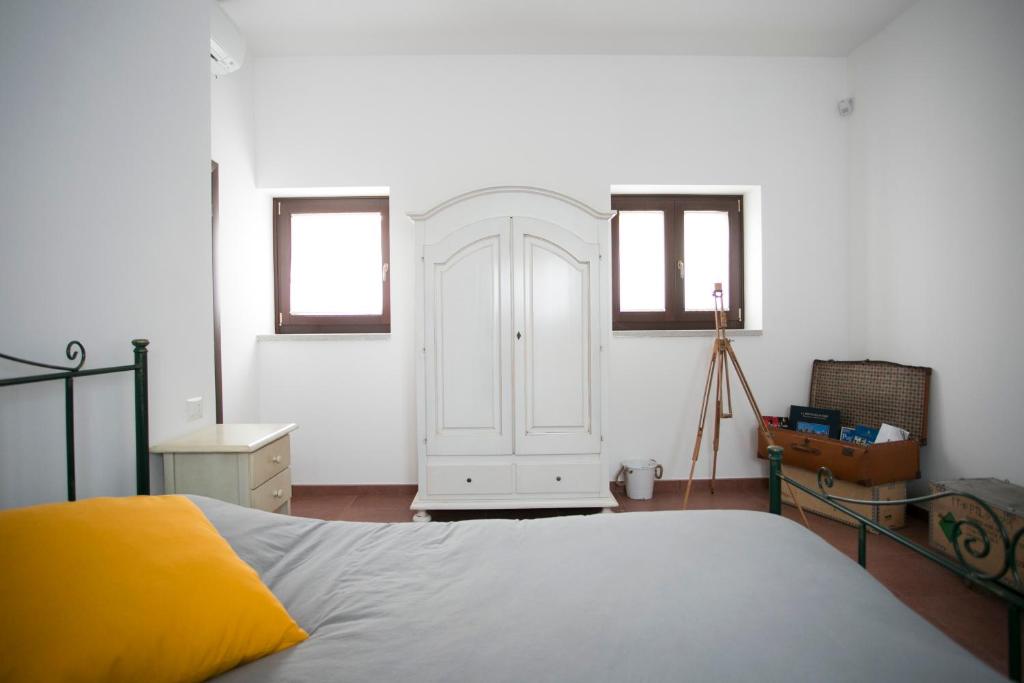 Postel nebo postele na pokoji v ubytování Masseria Stella