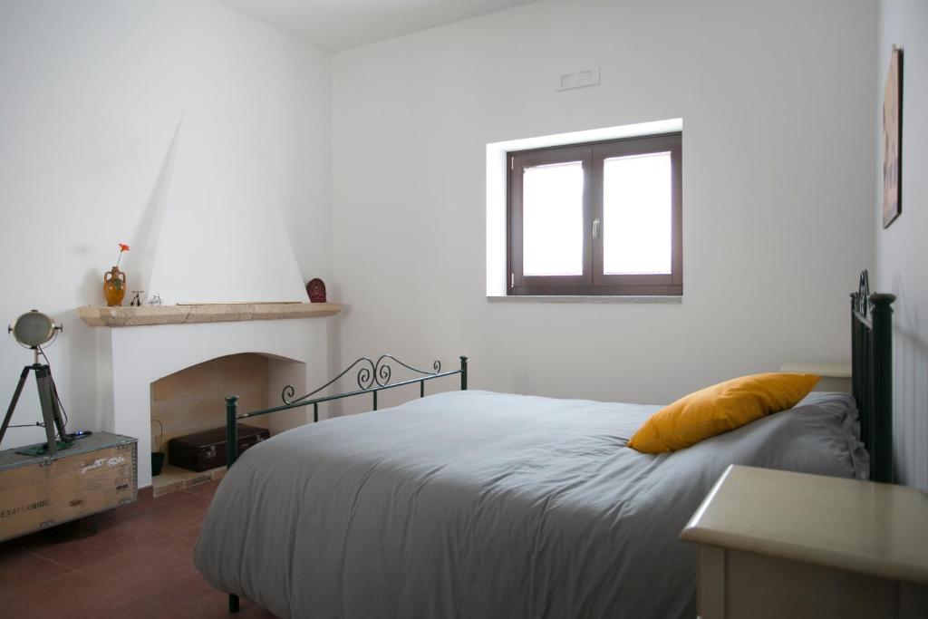 Postel nebo postele na pokoji v ubytování Masseria Stella