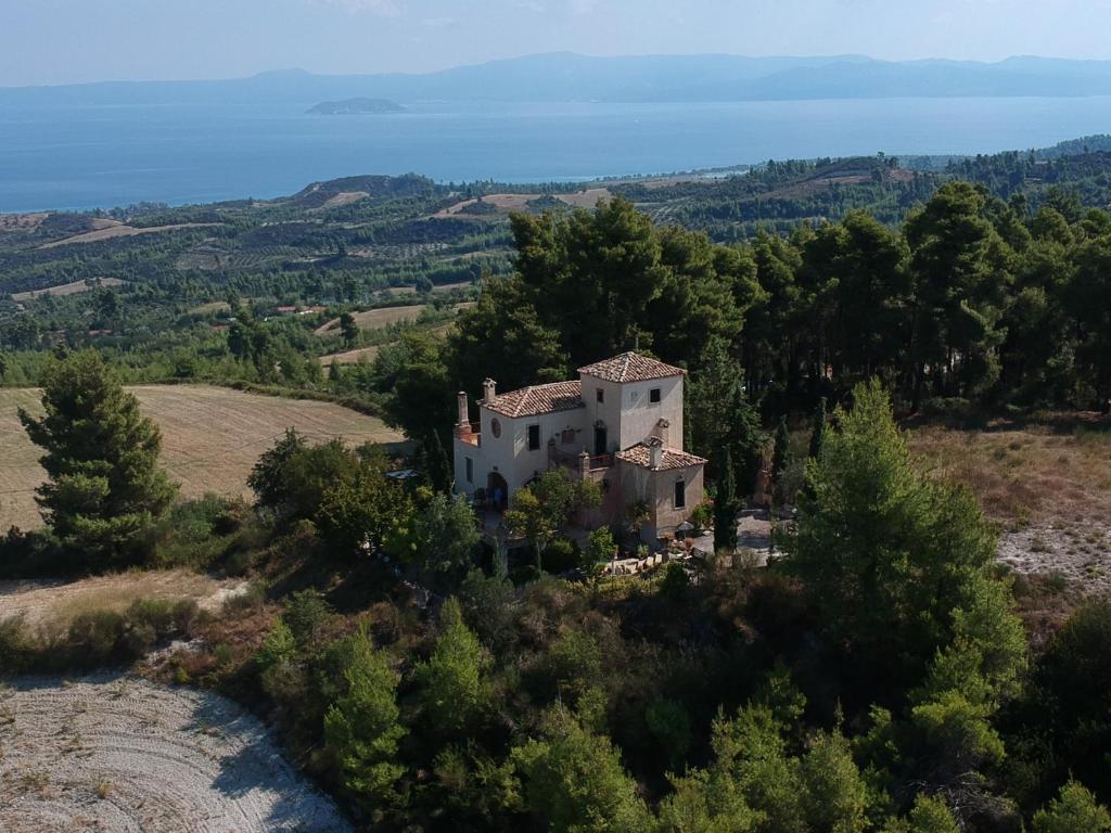 an aerial view of a house on a hill at Iliaxtida Apartment in Agia Paraskevi