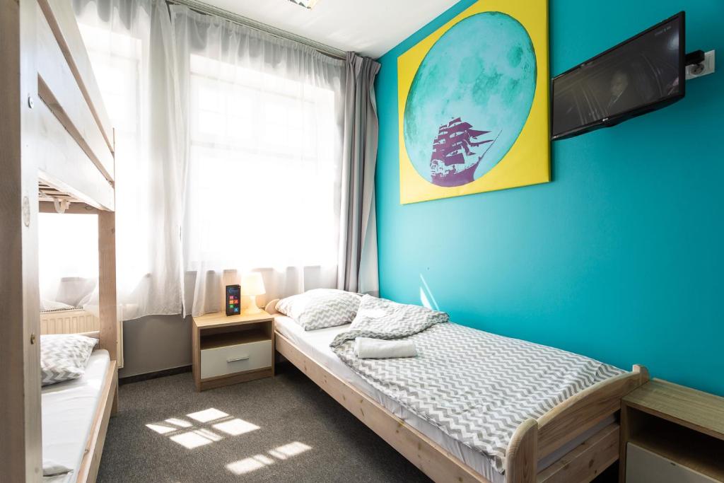 Postel nebo postele na pokoji v ubytování Moon Hostel Gdańsk