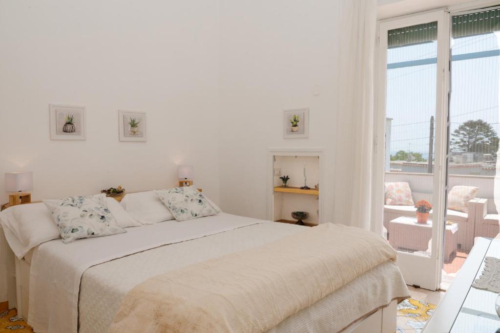 Postel nebo postele na pokoji v ubytování Casa Rubina