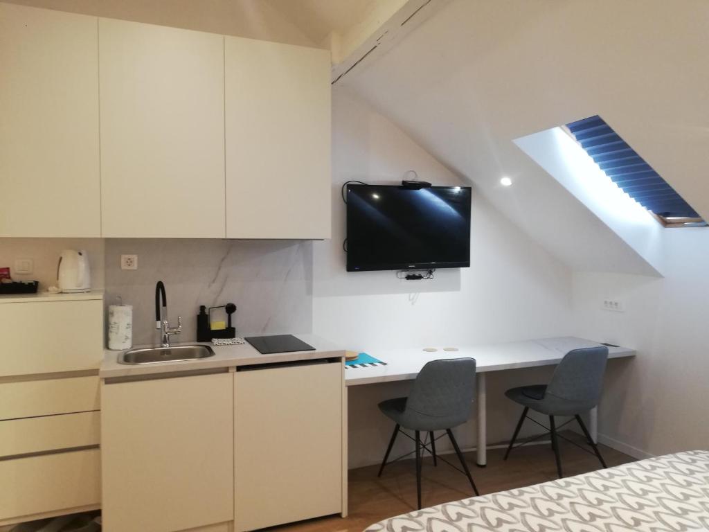 Kuchyň nebo kuchyňský kout v ubytování Apartments Simple Teslina
