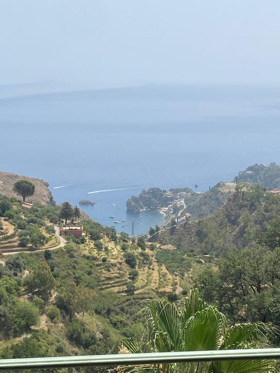 a view of the ocean from a hill at Mi 'ffaciu e mi ricriu casa vacanze in Castelmola