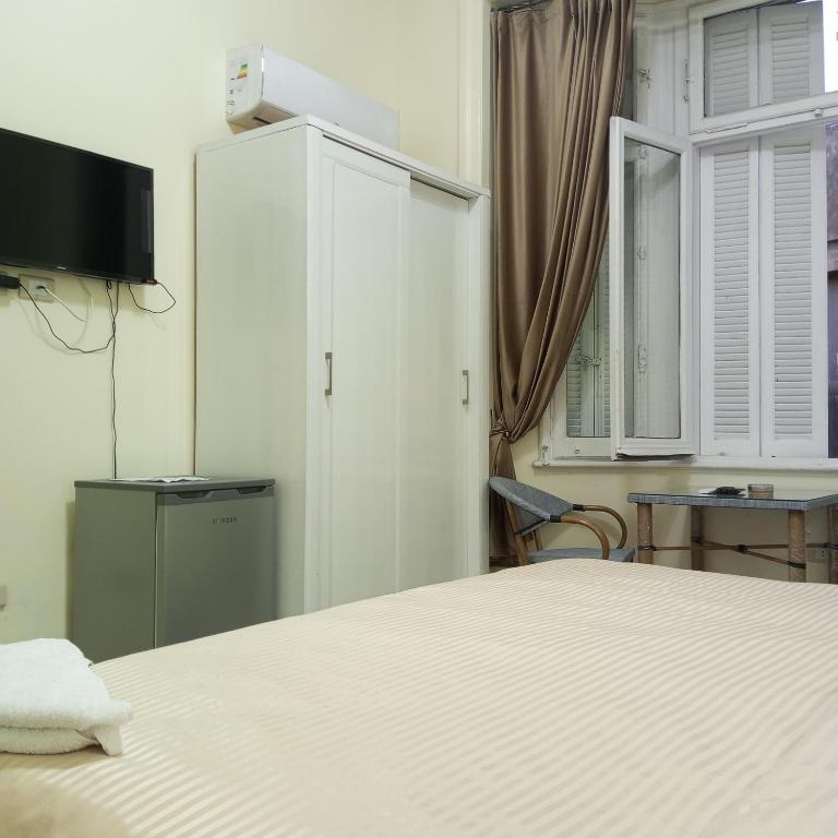 TV a/nebo společenská místnost v ubytování New Panorama Palace