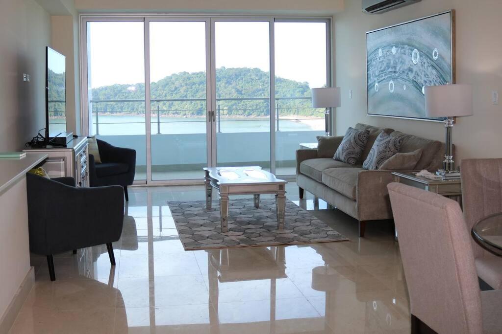 a living room with a couch and a table at 09B Perfect 1-bedroom apartment with stunning view in ArraijÃ¡n