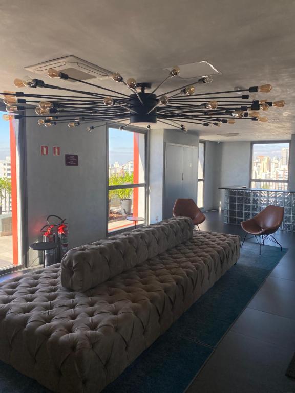 Giường trong phòng chung tại Studio Perdizes