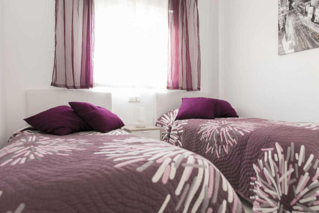 Postel nebo postele na pokoji v ubytování Apartment Aguila Real