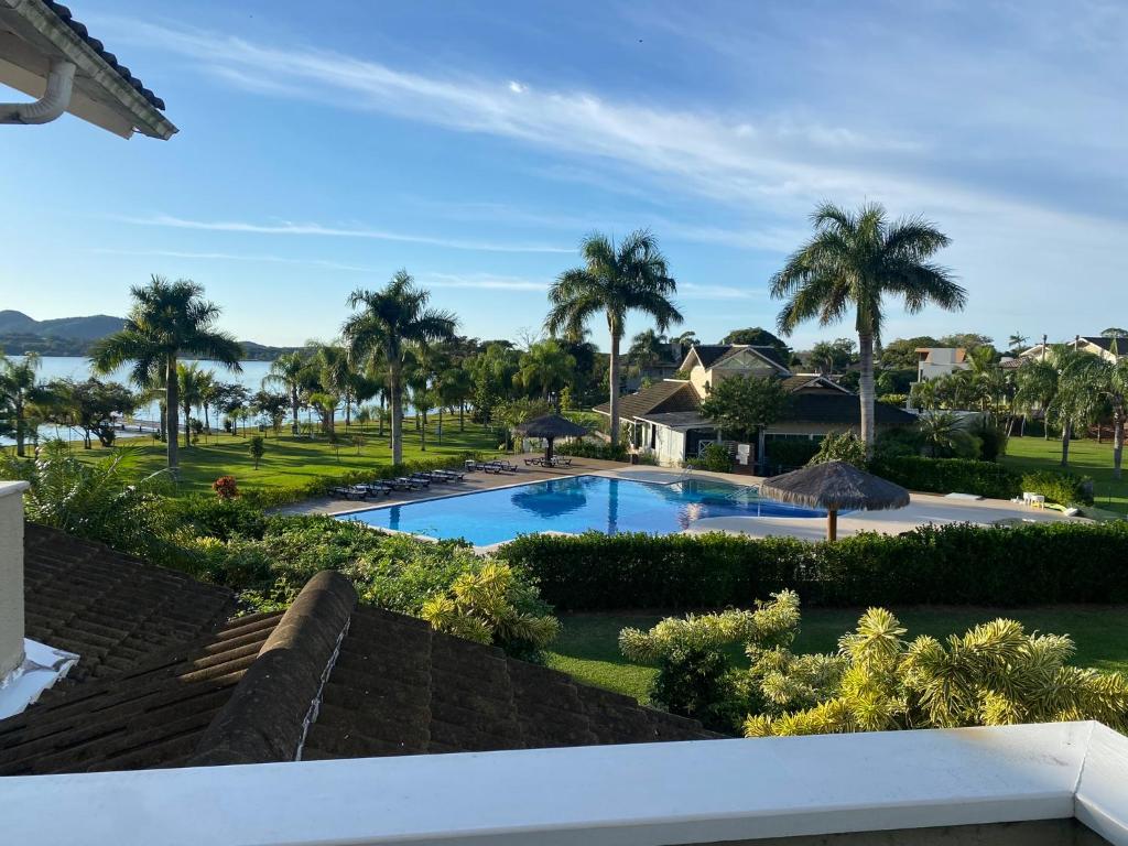 a view of the pool from the balcony of a resort at Casa em Resort na Lagoa da Conceição in Florianópolis