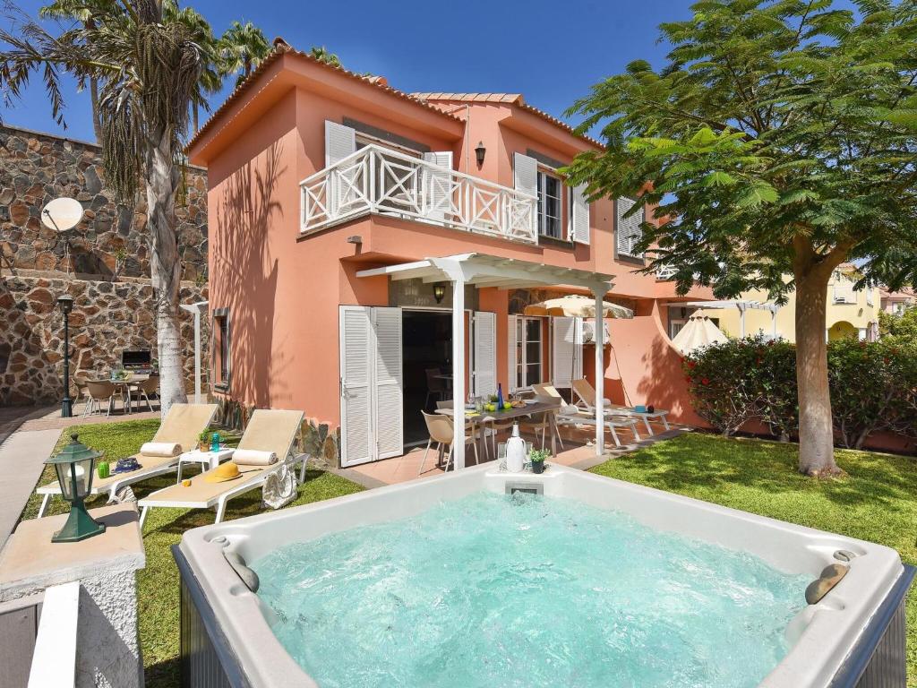 a bath tub in front of a house at Fantastic holiday home in Playa del Ingles a few meters from the beach in Playa del Ingles