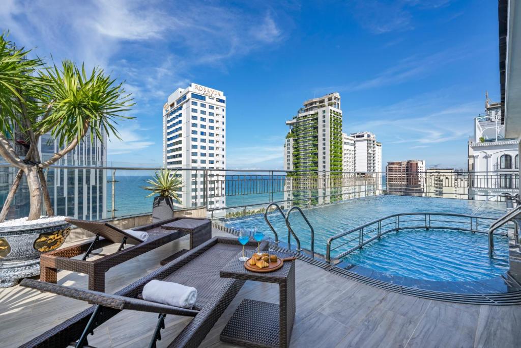 a balcony with a swimming pool on top of a building at Monalisa Luxury Hotel in Da Nang