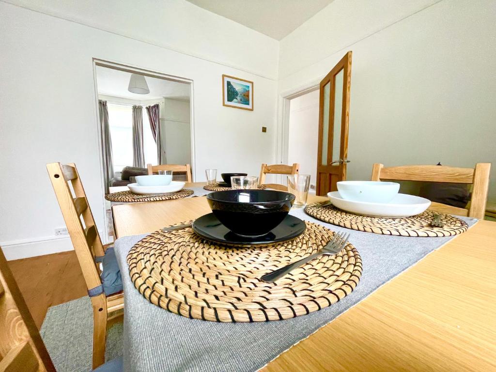 a dining room table with a bowl on top of it at New Brighton Beach in Wallasey