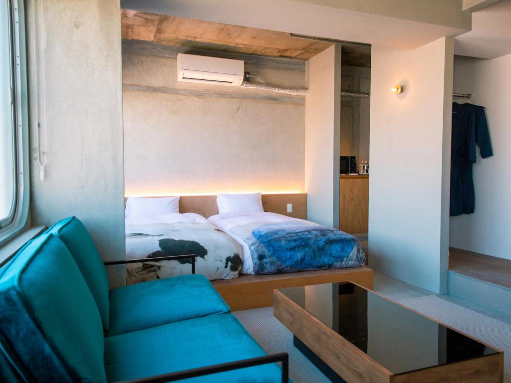 Postel nebo postele na pokoji v ubytování Kagan Hotel & Hostel