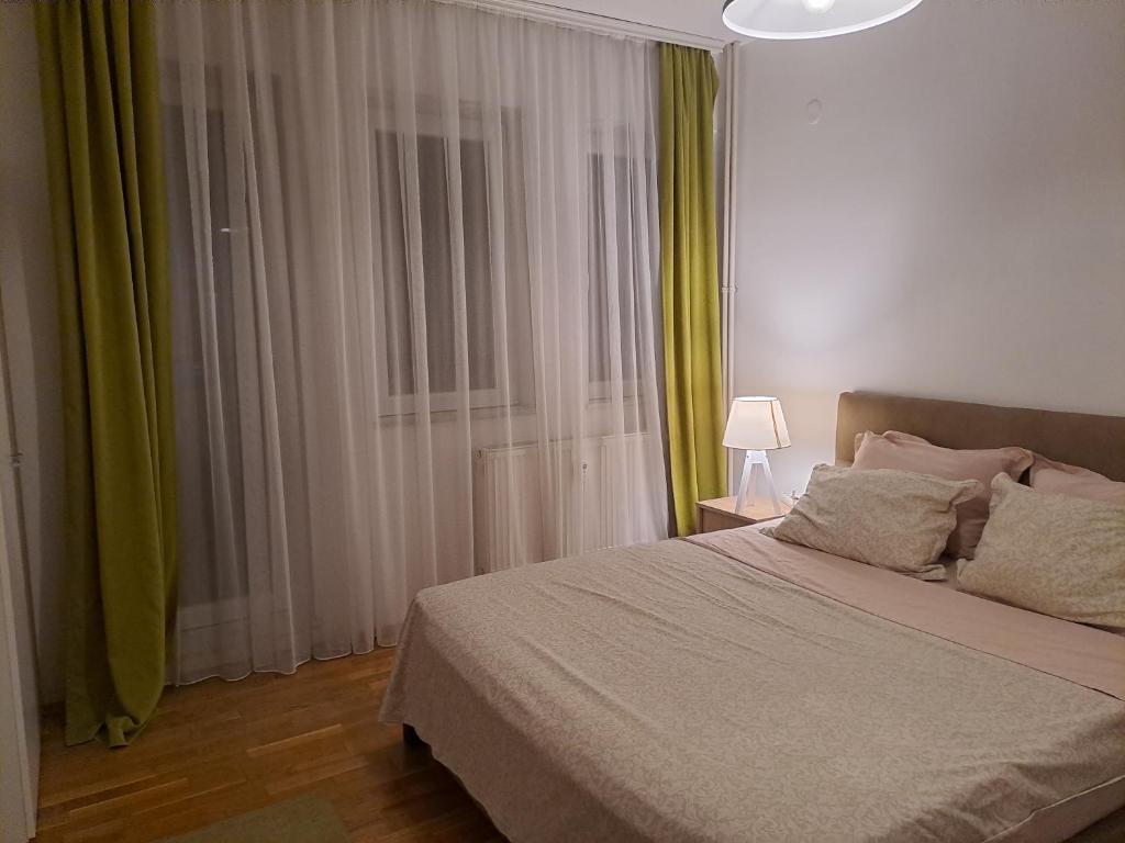 Postelja oz. postelje v sobi nastanitve Prishtina Center Apartment