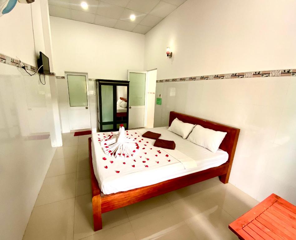 Postel nebo postele na pokoji v ubytování Song Ngoc Guesthouse