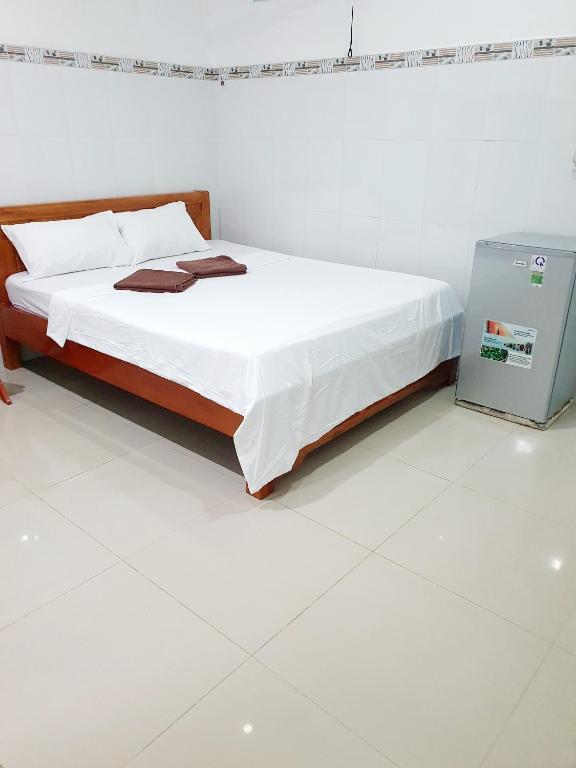 Postel nebo postele na pokoji v ubytování Song Ngoc Guesthouse