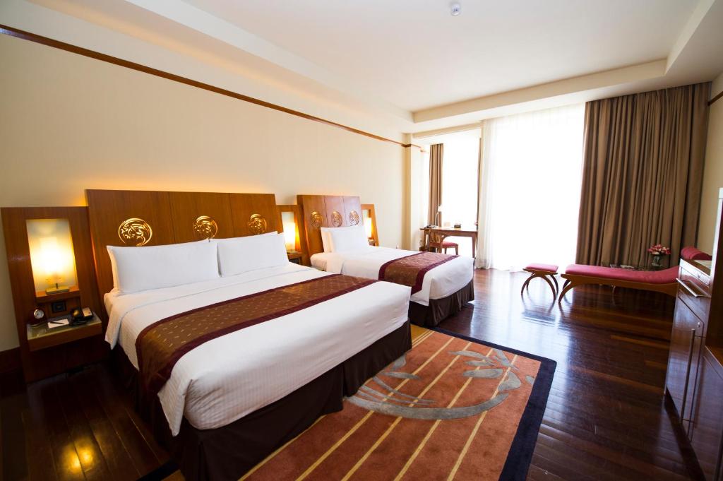 Postel nebo postele na pokoji v ubytování PULSE GRANDE Hotel Putrajaya