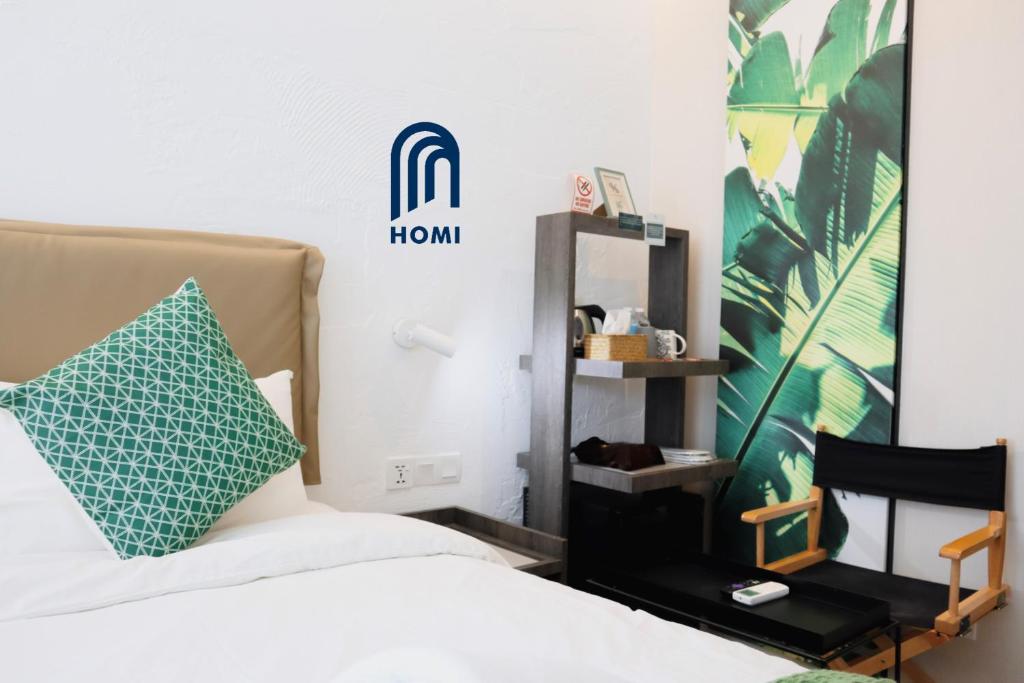 Postel nebo postele na pokoji v ubytování Homi Oasis at KK Times Square 和逸绿洲