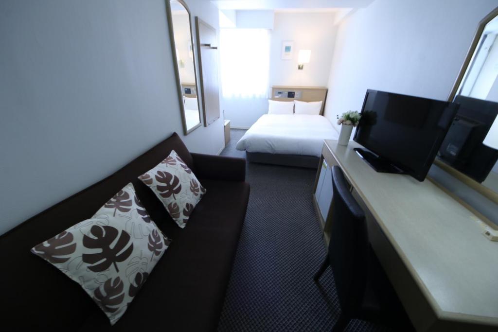 Postel nebo postele na pokoji v ubytování Grand Park Hotel Panex Chiba