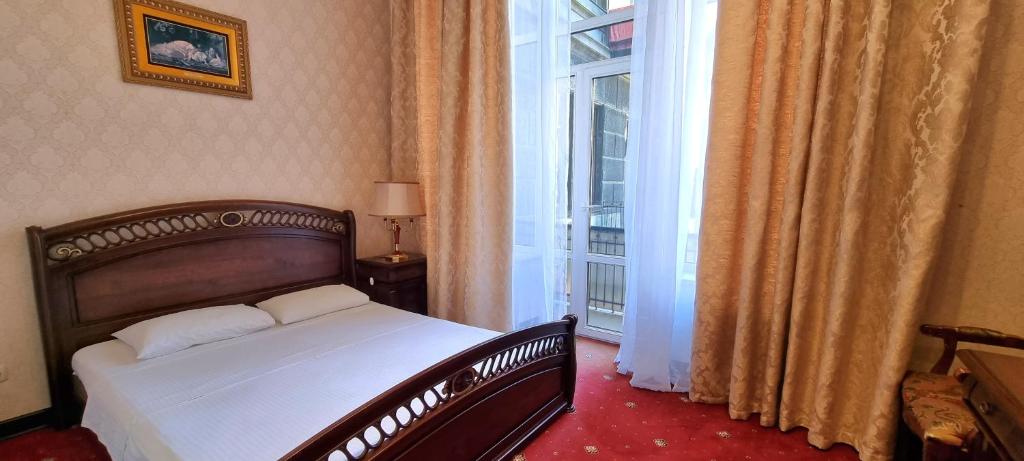 Postel nebo postele na pokoji v ubytování Oreanda Hotel