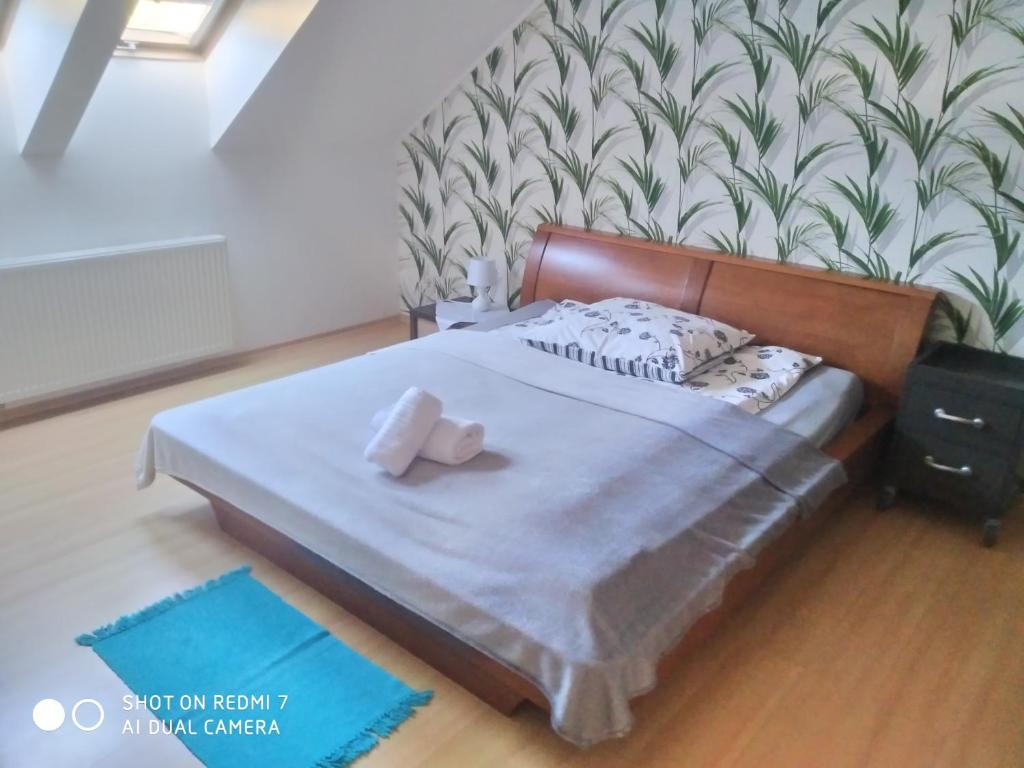 Posteľ alebo postele v izbe v ubytovaní Apartament przy Słonecznej