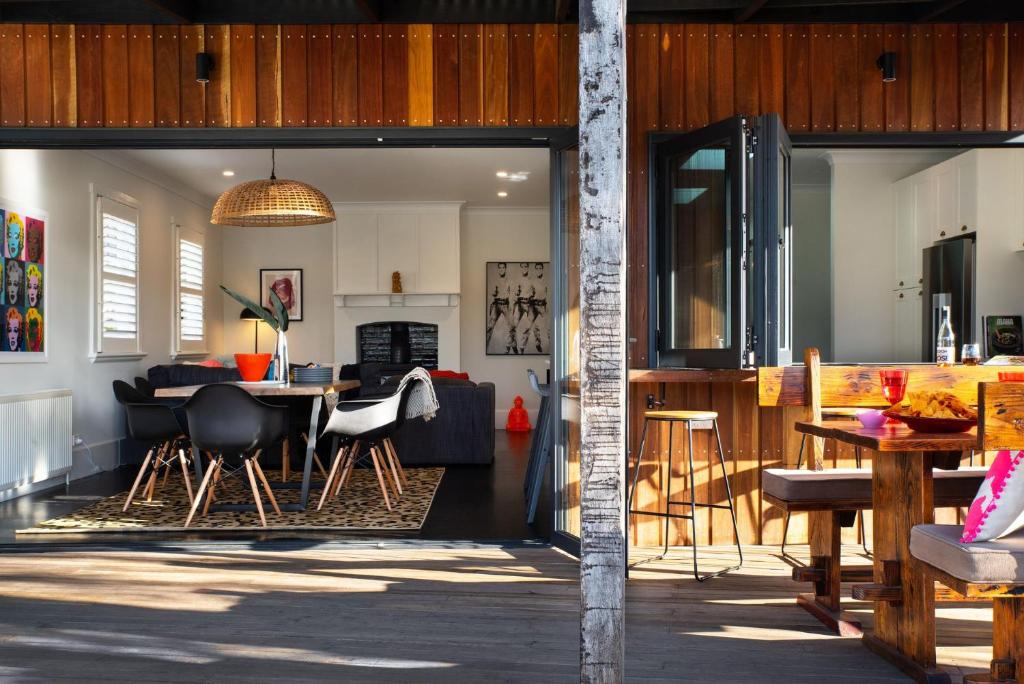 a living room and dining room with sliding glass doors at Fontaine in Daylesford