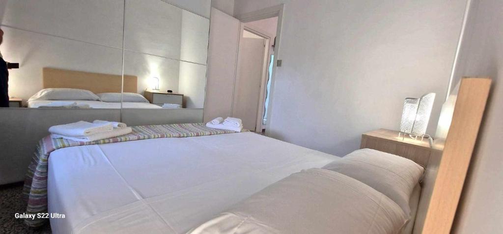 Tempat tidur dalam kamar di Olimpia Casa Vacanze
