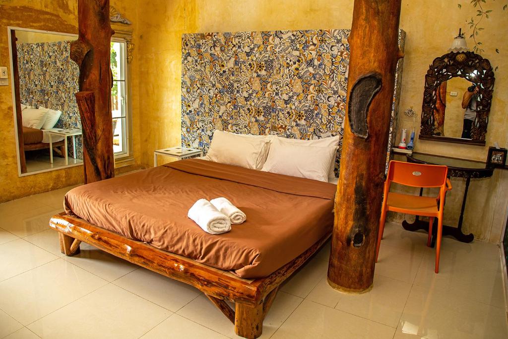 Postel nebo postele na pokoji v ubytování Yoko River Kwai Resort