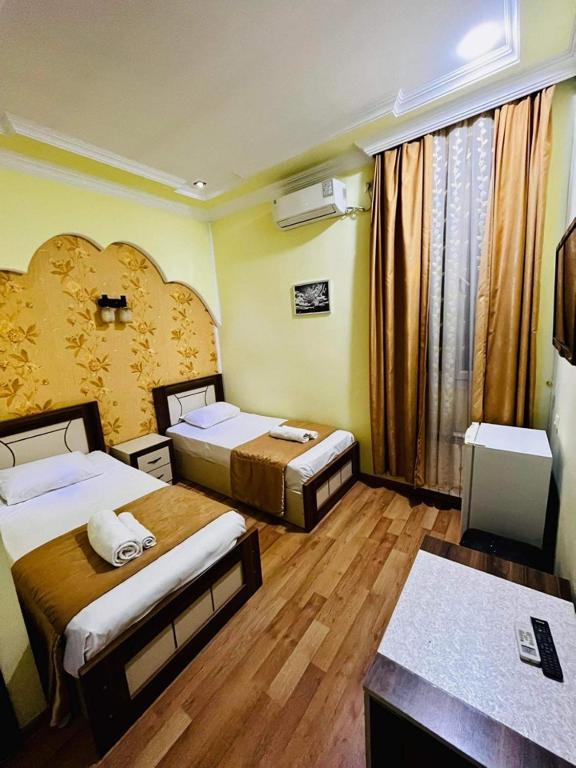 Postel nebo postele na pokoji v ubytování Lux Palace Hotel