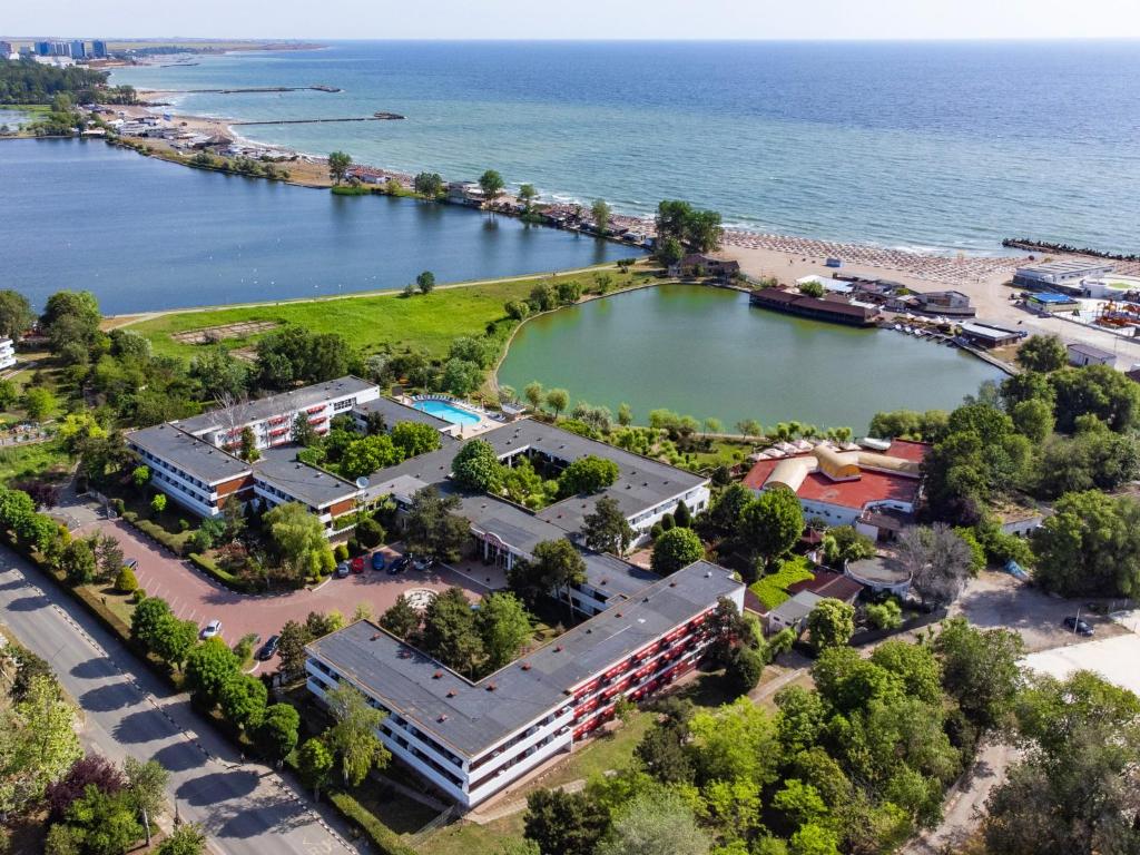 an aerial view of a resort next to a body of water at COMPLEX TISMANA 3* ALL INCLUSIVE in Jupiter