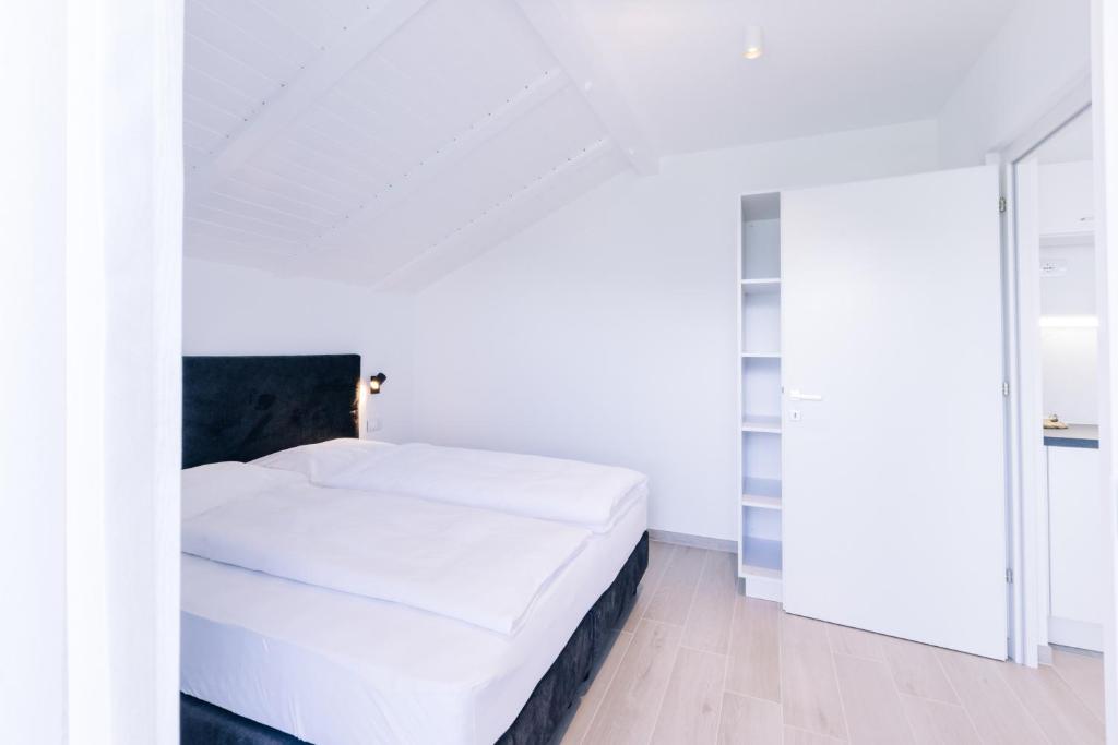Postel nebo postele na pokoji v ubytování Residence Martinelli