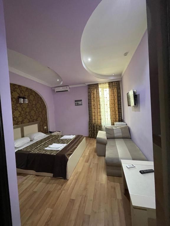 Postel nebo postele na pokoji v ubytování Lux Palace Hotel