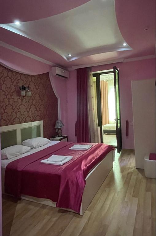 Postel nebo postele na pokoji v ubytování Lux Palace Hotel