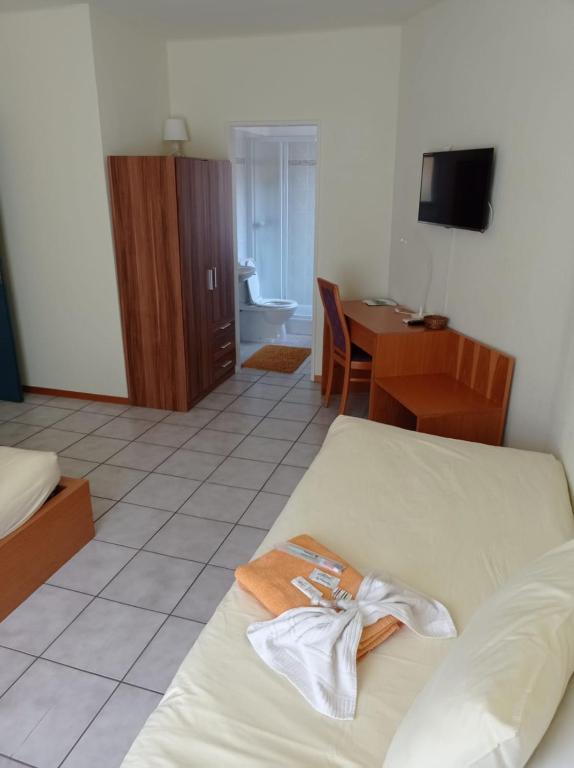 Ein Bett oder Betten in einem Zimmer der Unterkunft Hotel Ristorante Camoghe