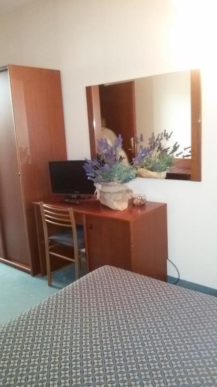 Posteľ alebo postele v izbe v ubytovaní Albergo Centrale