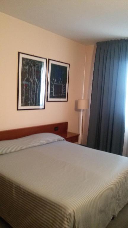Posteľ alebo postele v izbe v ubytovaní Albergo Centrale