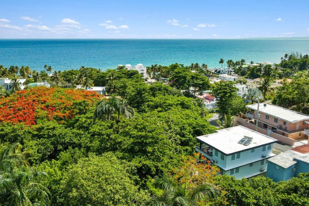 an aerial view of a city and the ocean at Casa al Mare #3- 1 bdr - 4 min walk to Sandy Beach in Rincon