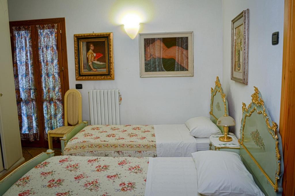 Łóżko lub łóżka w pokoju w obiekcie Bed & Breakfast Il Giardino