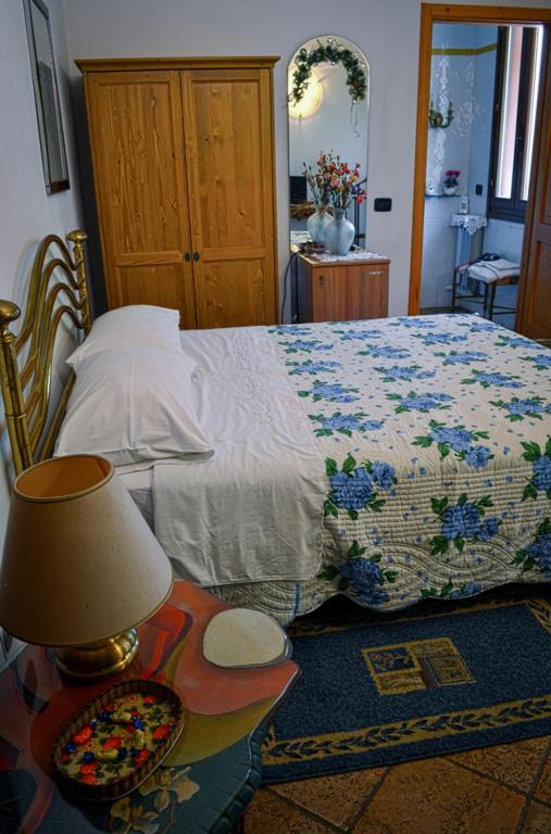 Łóżko lub łóżka w pokoju w obiekcie Bed & Breakfast Il Giardino
