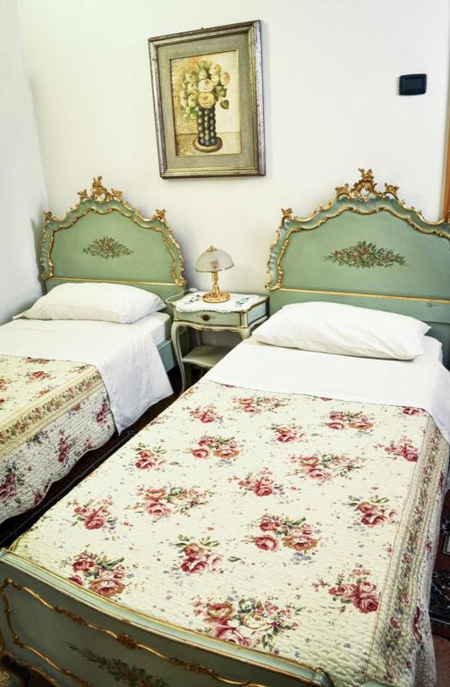 Łóżko lub łóżka w pokoju w obiekcie Bed & Breakfast Il Giardino