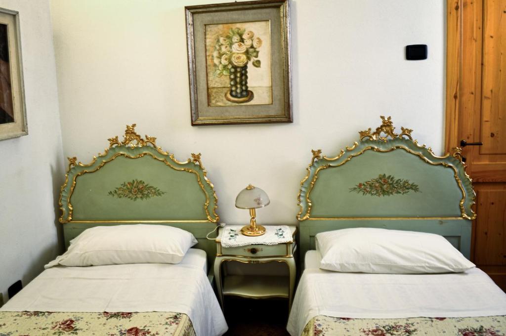 Łóżko lub łóżka w pokoju w obiekcie Bed & Breakfast Il Giardino