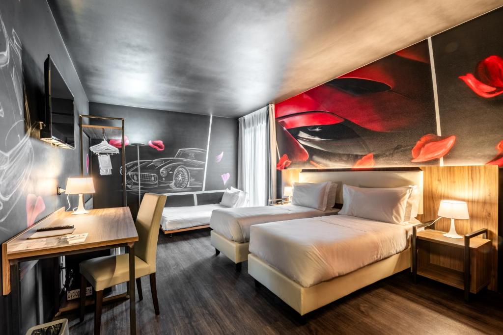 Postel nebo postele na pokoji v ubytování Muraless Art Hotel - WorldHotels Crafted