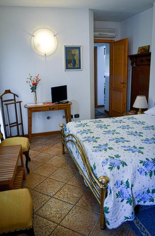 Łóżko lub łóżka w pokoju w obiekcie Bed & Breakfast Il Giardino
