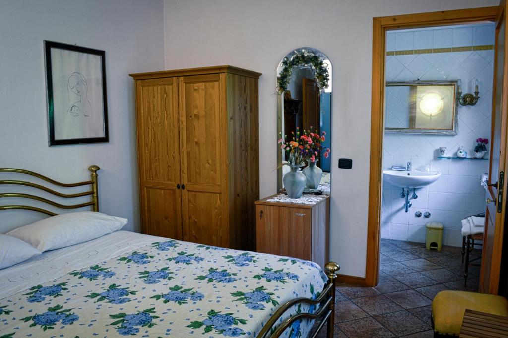 Łóżko lub łóżka w pokoju w obiekcie Bed & Breakfast Il Giardino