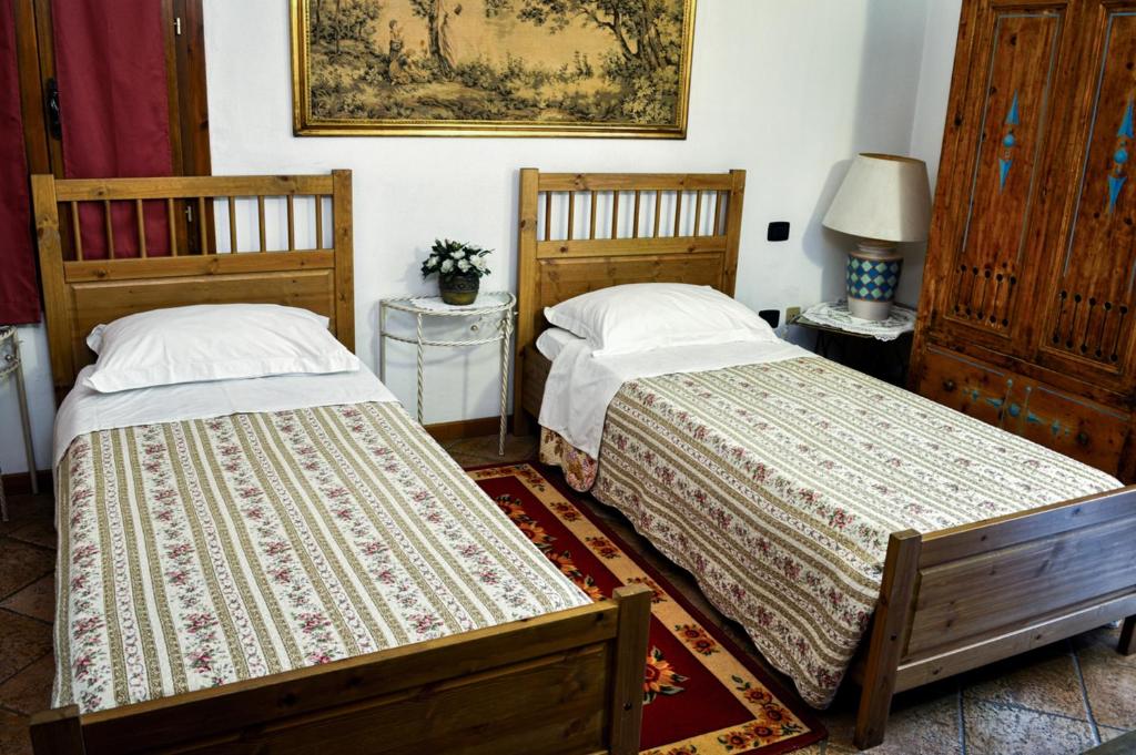 Łóżko lub łóżka w pokoju w obiekcie Bed & Breakfast Il Giardino