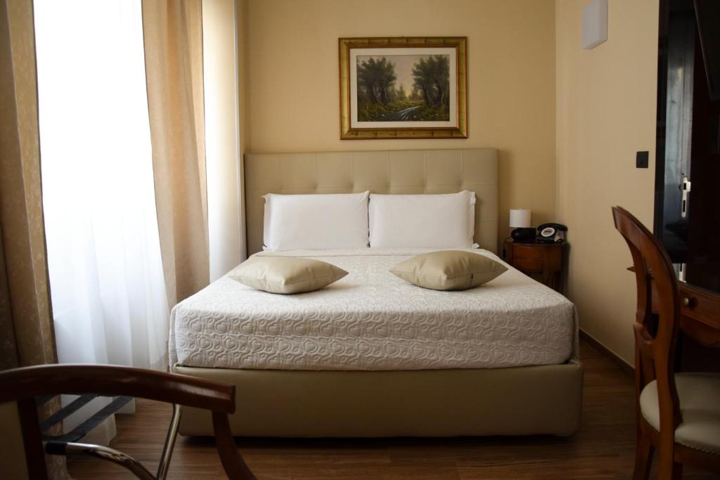 Postel nebo postele na pokoji v ubytování Hotel Valentino Du Parc