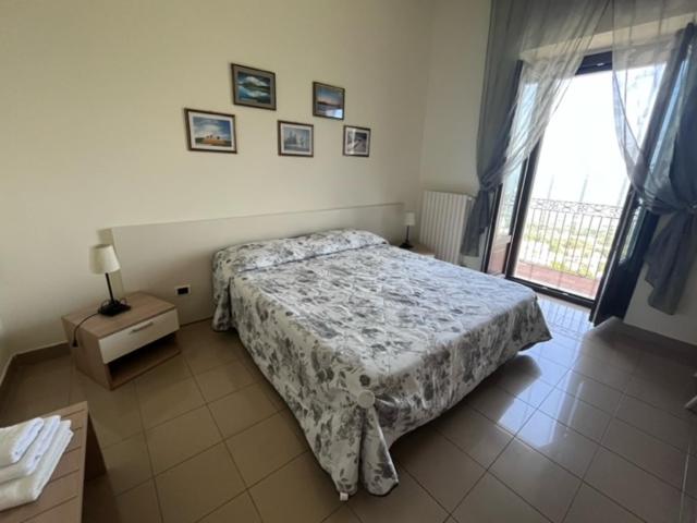 Postel nebo postele na pokoji v ubytování B&B Casa Miraglia