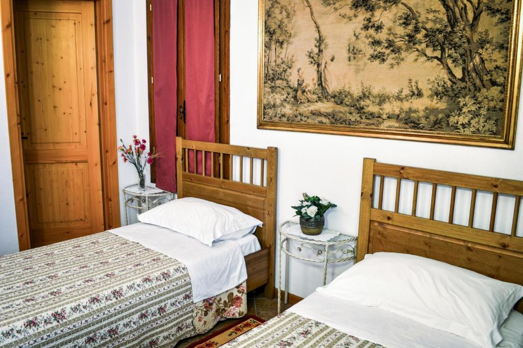 Łóżko lub łóżka w pokoju w obiekcie Bed & Breakfast Il Giardino