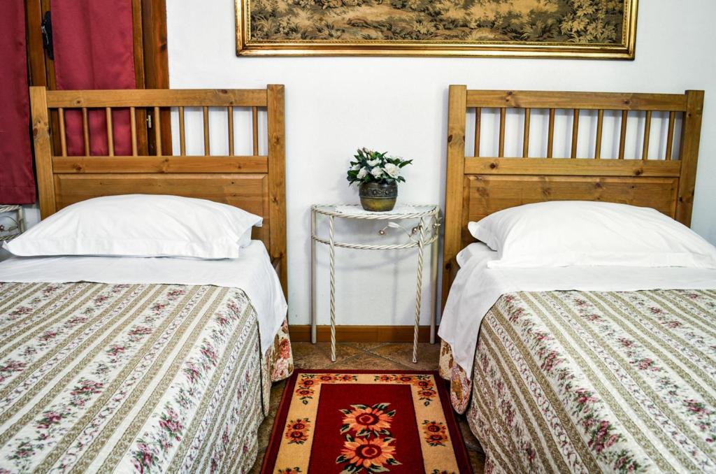 Łóżko lub łóżka w pokoju w obiekcie Bed & Breakfast Il Giardino